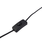 Black cable with a switch on a white background