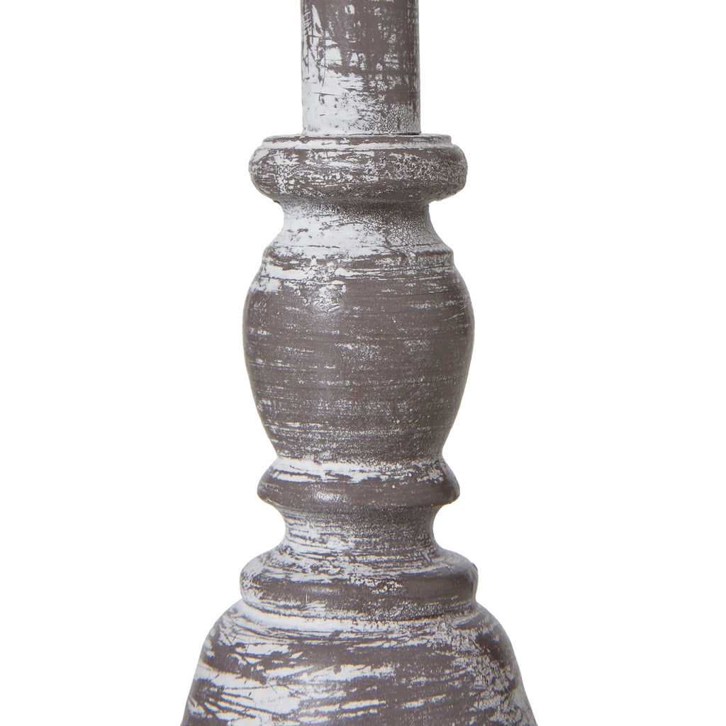 Decorative table lamp column with a rustic finish on a white background