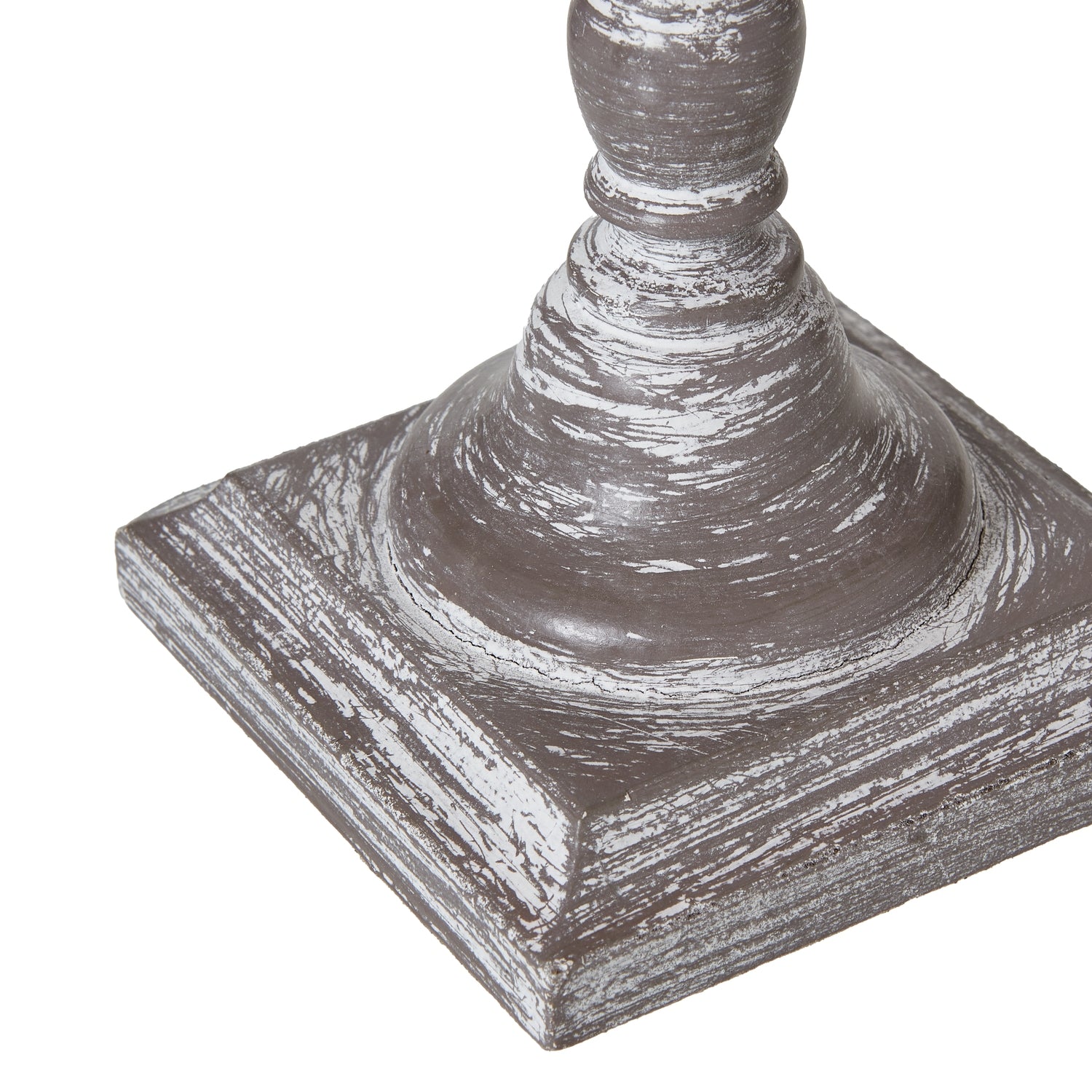 Decorative table lamp base with a square base and cylindrical top on a white background