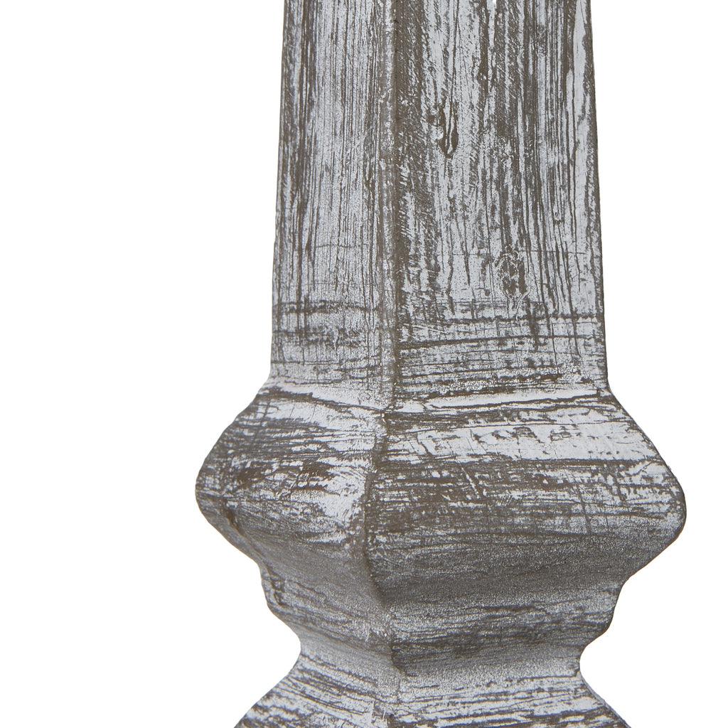 Wooden table lamp column with textured surface on a white background