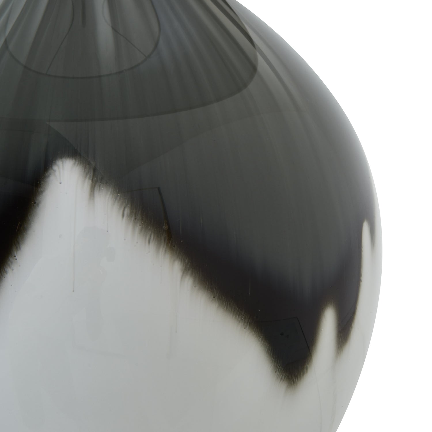 Close-up of a grey and white glass vase on a white background
