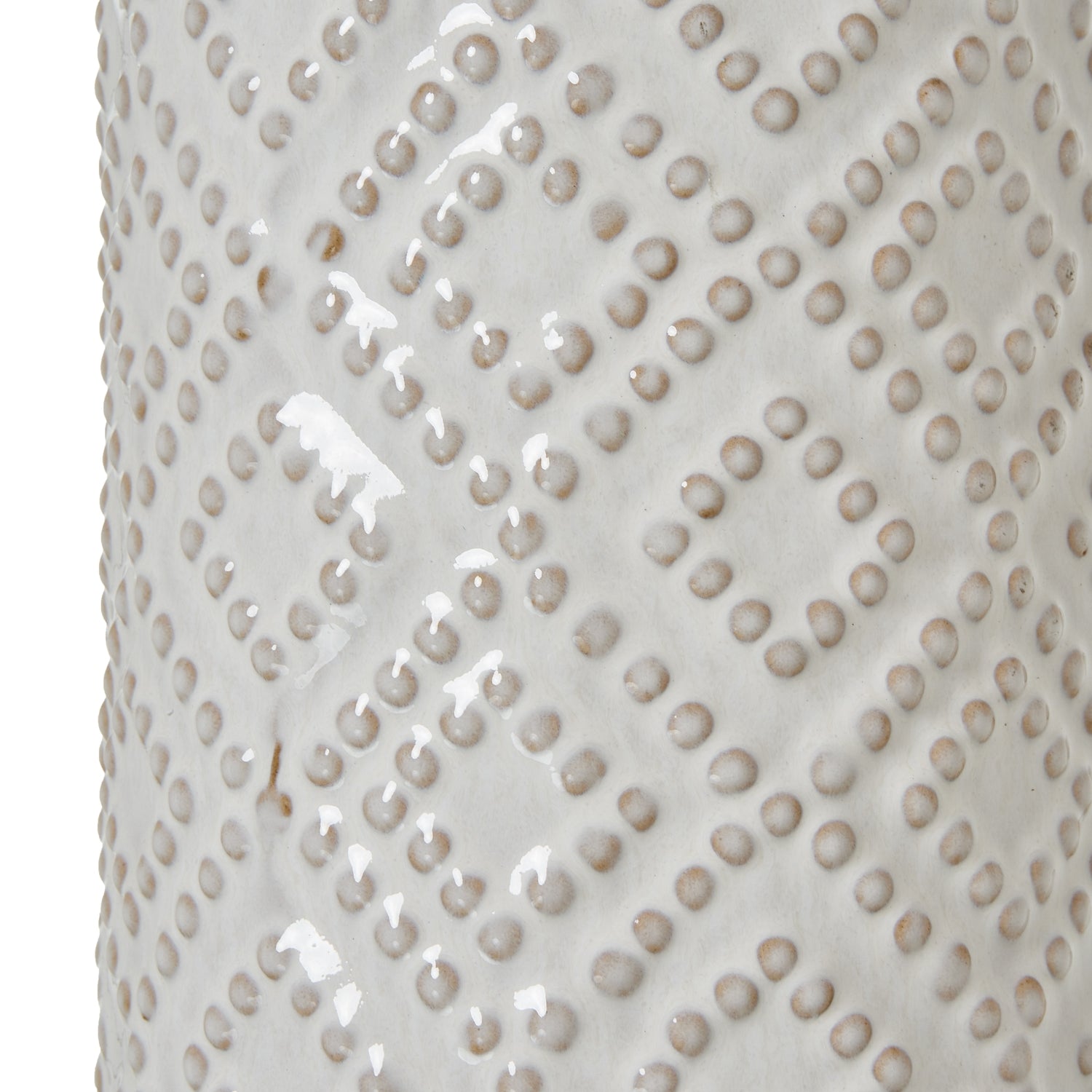 White ceramic table lamp with textured pattern on a white background