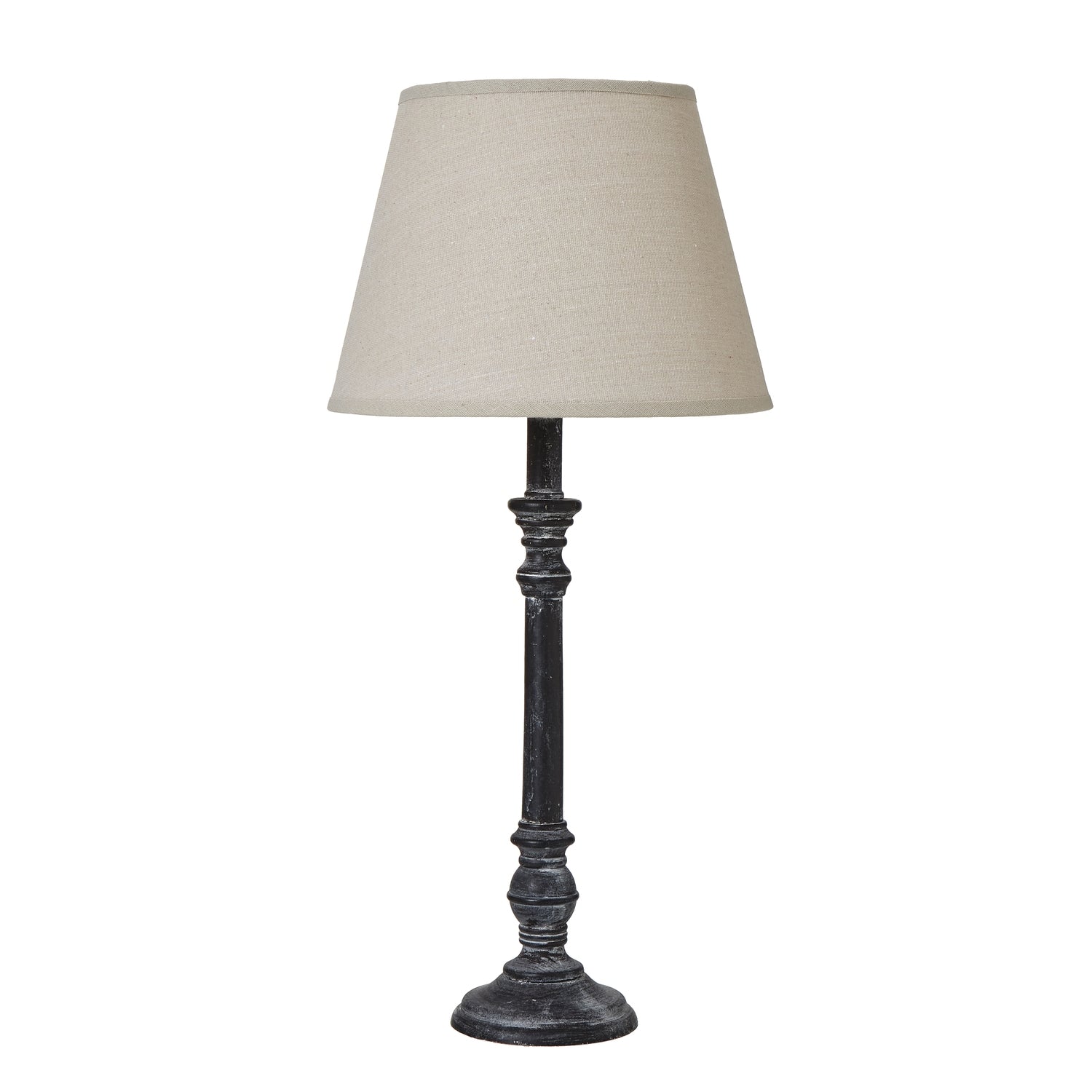 Table lamp with a cream shade on a white background
