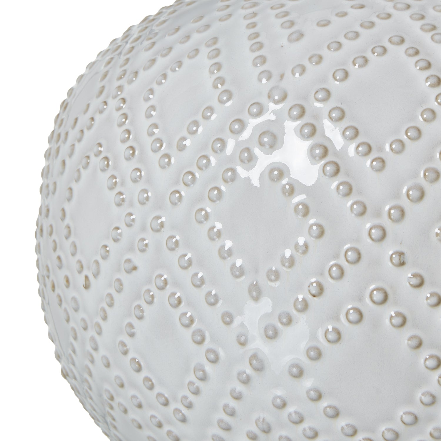 White ceramic table lamp with a textured surface on a white background