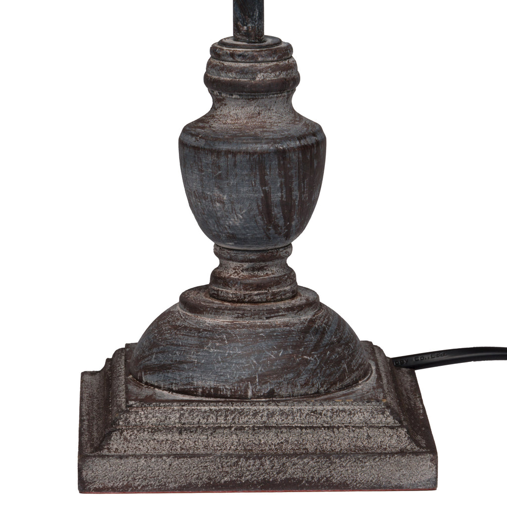 Decorative lamp base with a textured finish on a white background