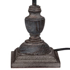 Decorative lamp base with a textured finish on a white background