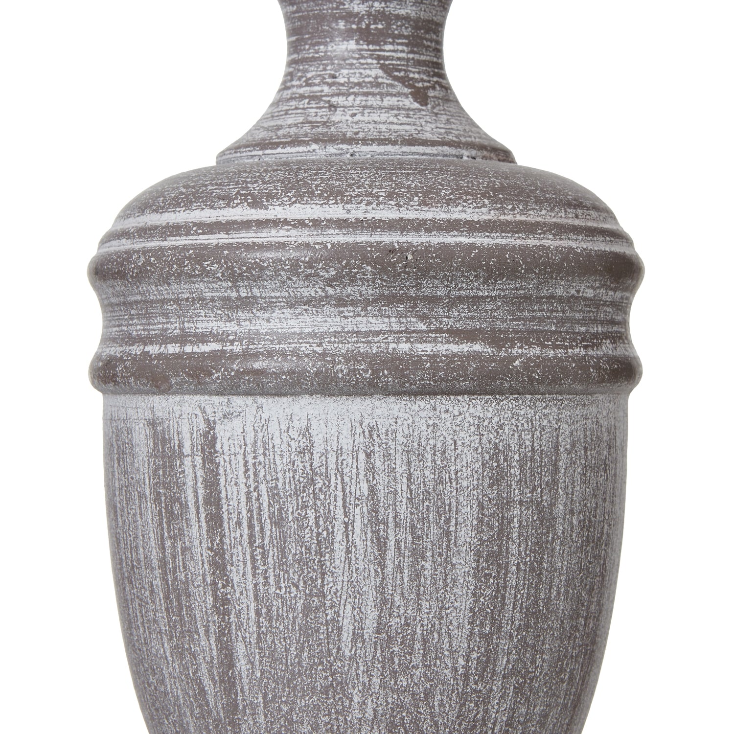 Decorative urn table lamp with a textured surface on a white background
