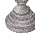 Decorative table lamp base with a textured surface on a white background