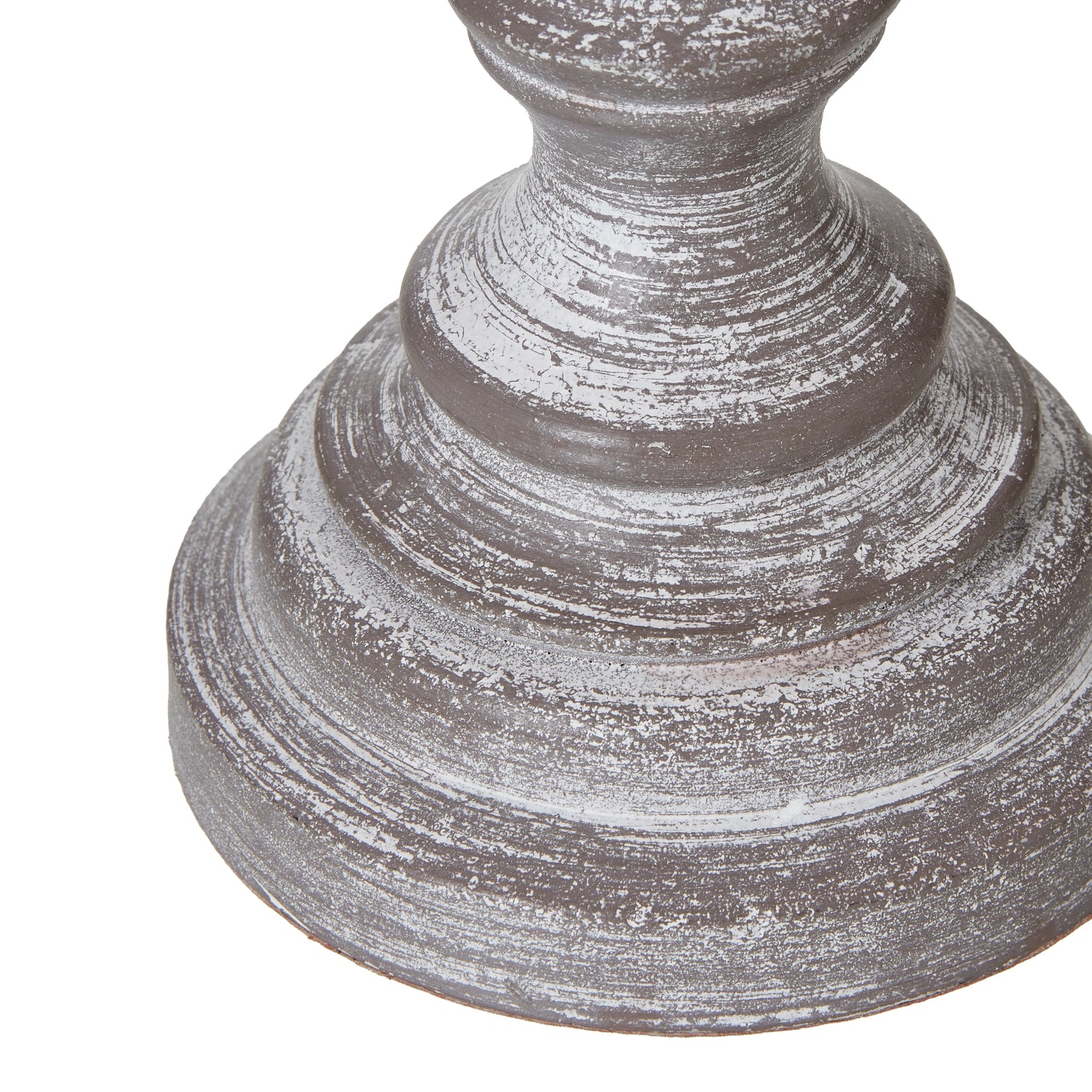 Decorative table lamp base with a textured surface on a white background