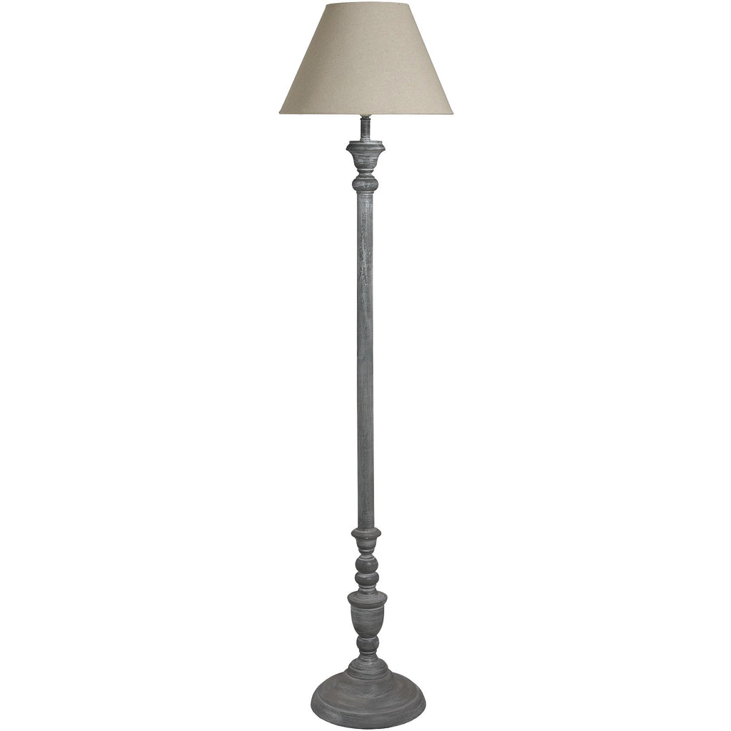 Floor lamp with a grey base and cream lampshade on a white background