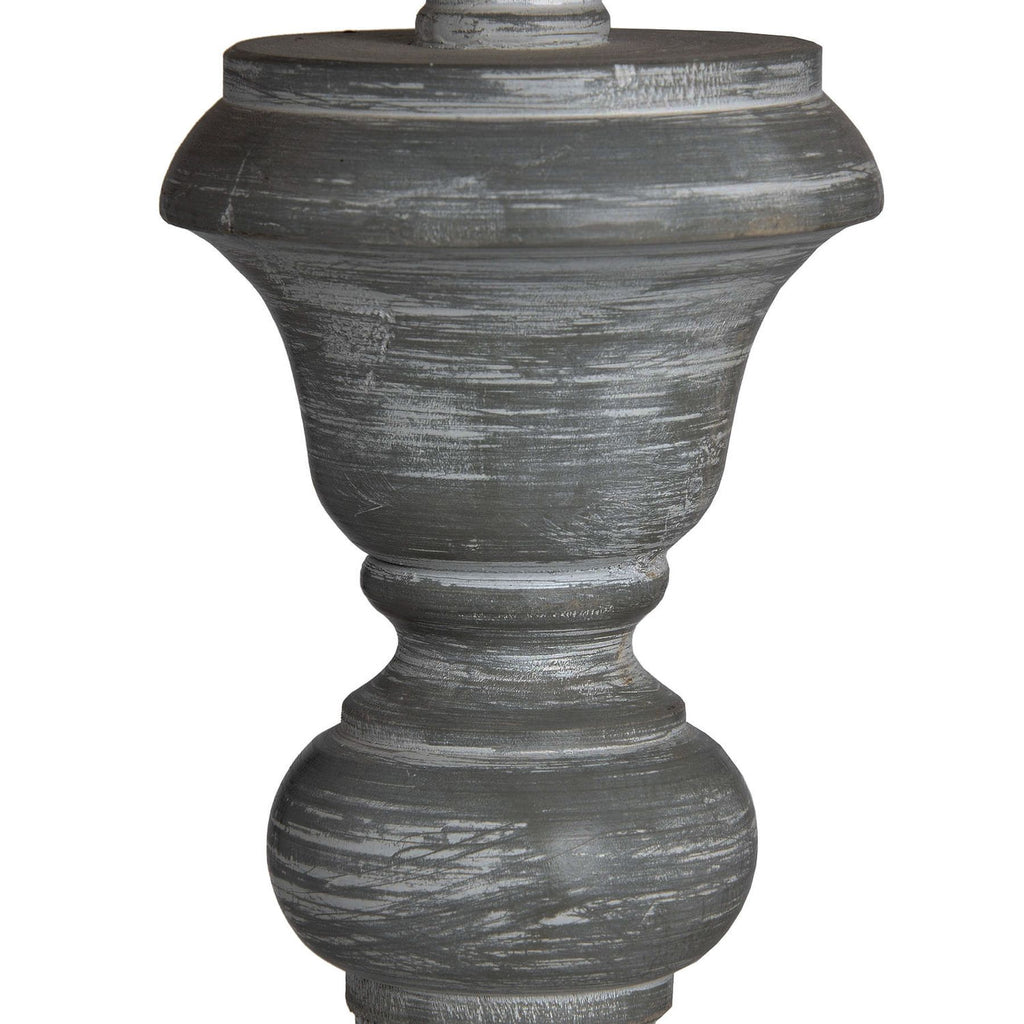 Decorative floor lamp close-up with a textured surface on a white background