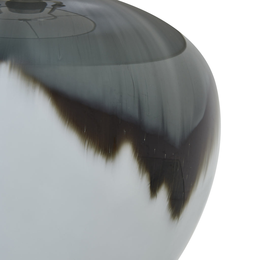 Close-up of black and white glass lamp body and white background