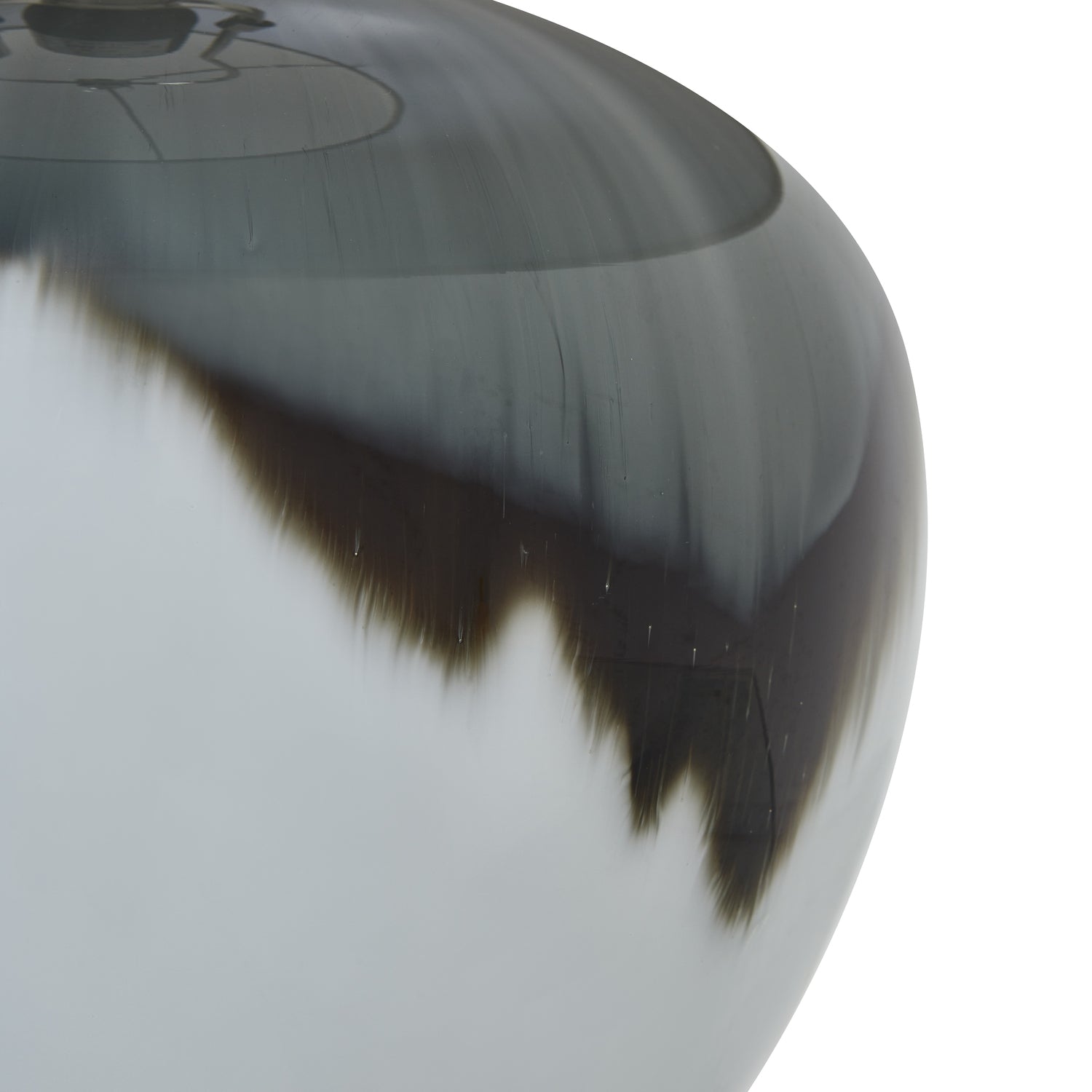 Close-up of black and white glass lamp body and white background
