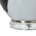 Close-up of glass lamp base on a white background
