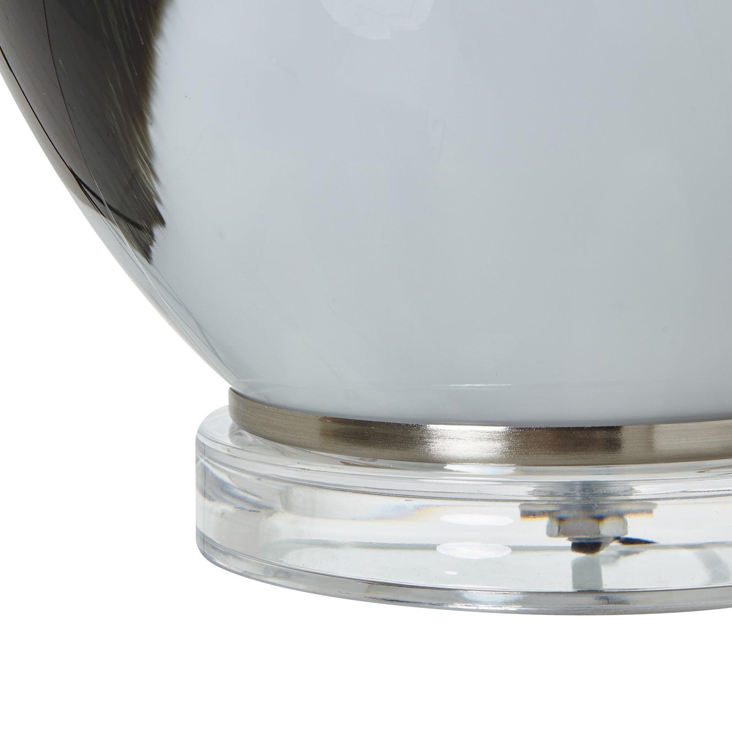 Close-up of glass lamp base on a white background