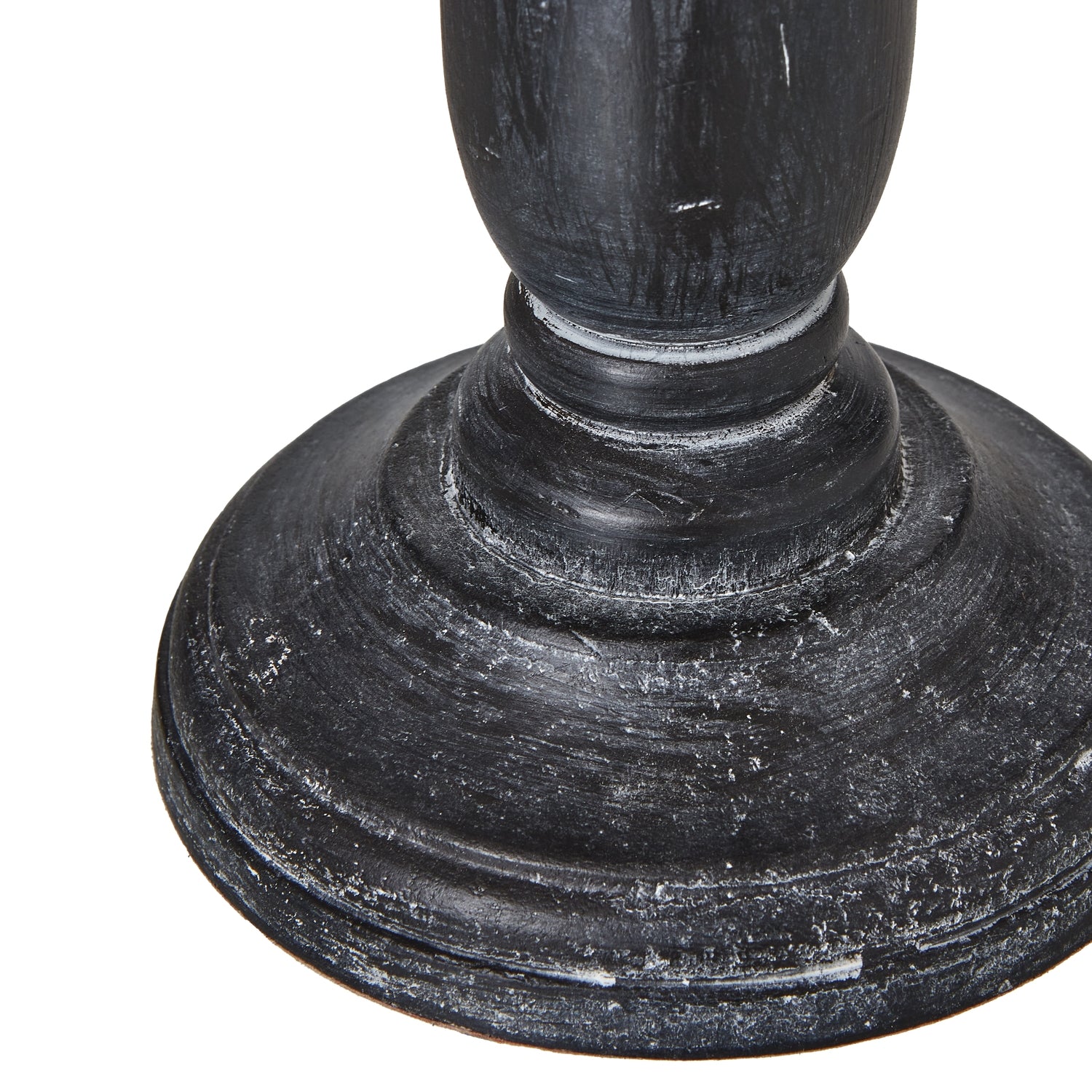 Close-up of dark wooden table lamp base on a white background