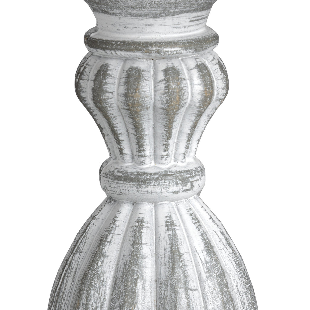 Wooden table lamp with a ribbed design on a white background
