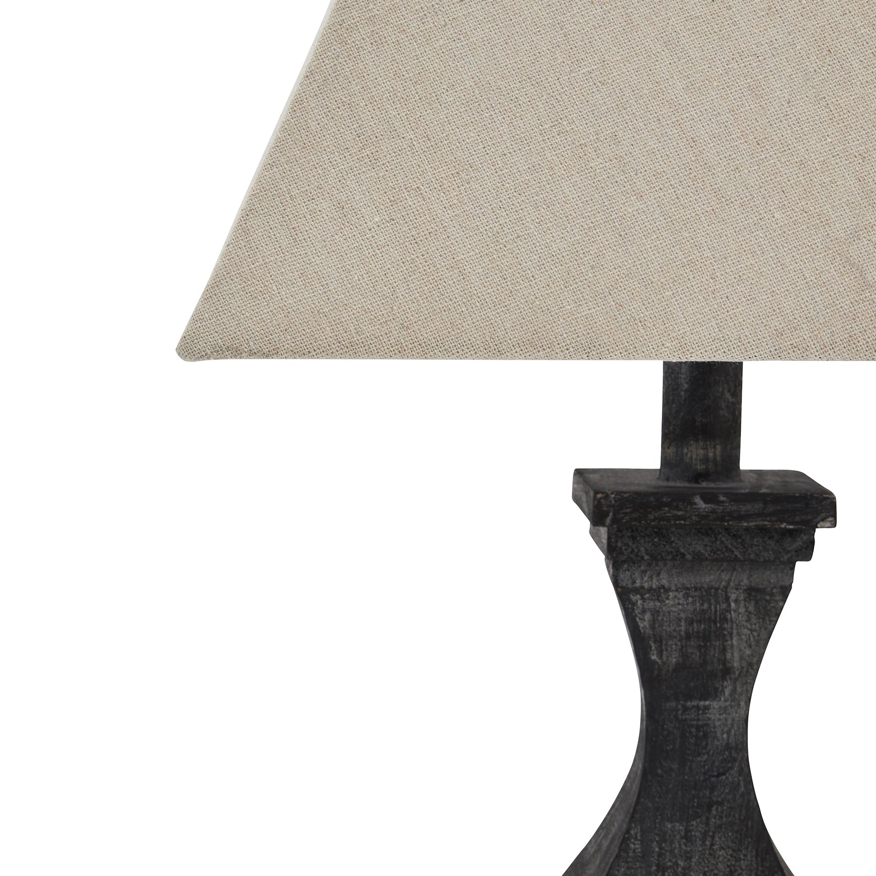 Table lamp with a textured beige shade and dark wooden base on a white background