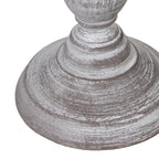 Close-up of a textured grey table lamp base on a white background