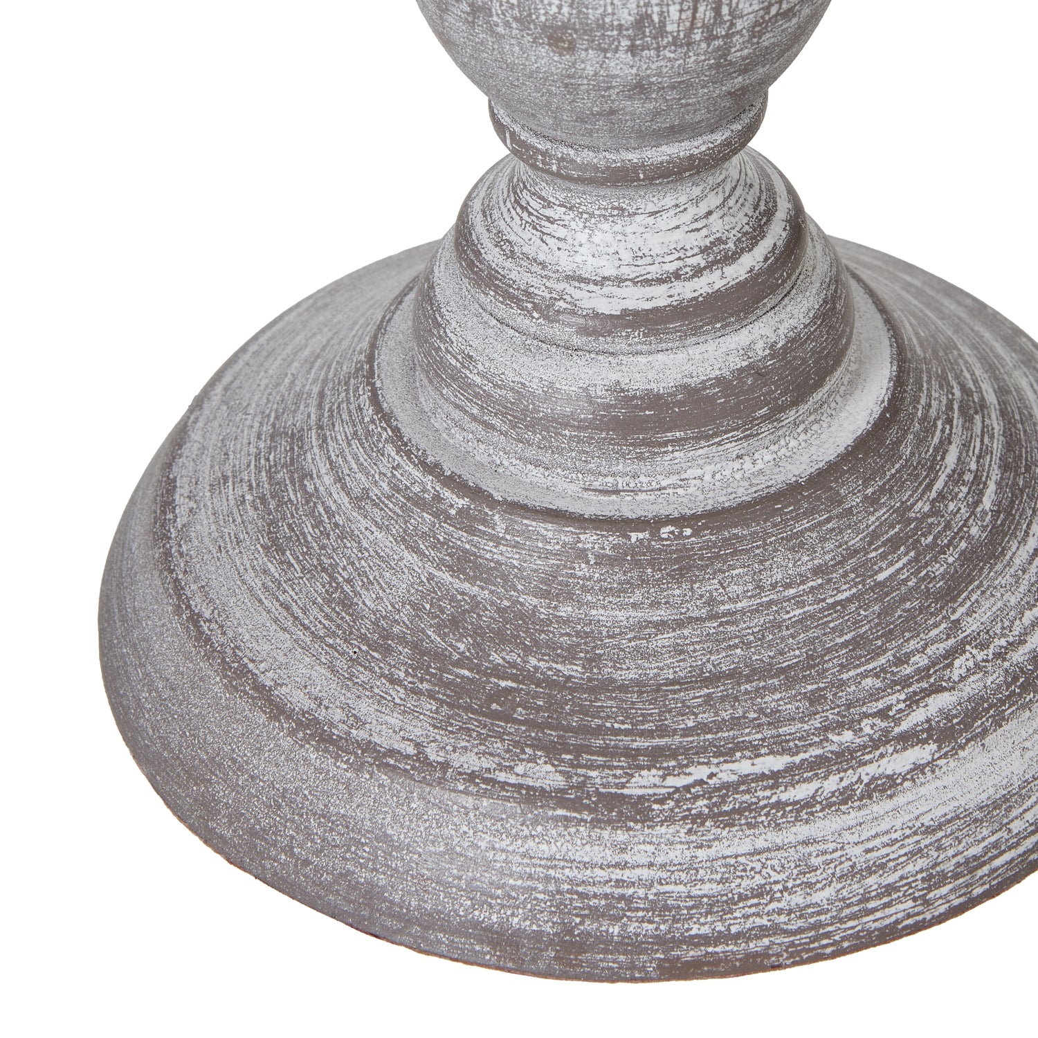 Close-up of a textured grey table lamp base on a white background