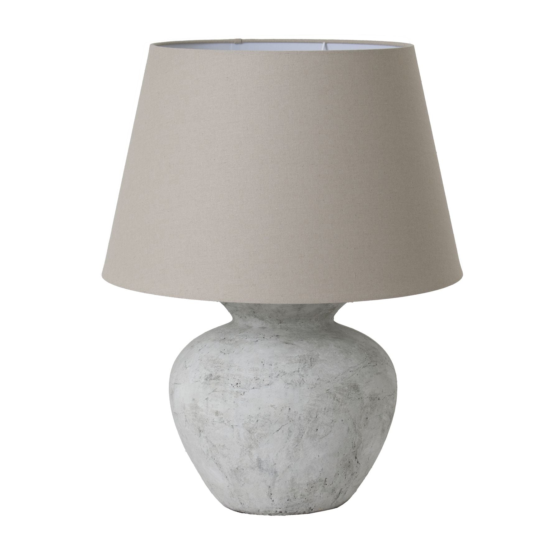 Table lamp with a textured white base and a beige lampshade on a white background